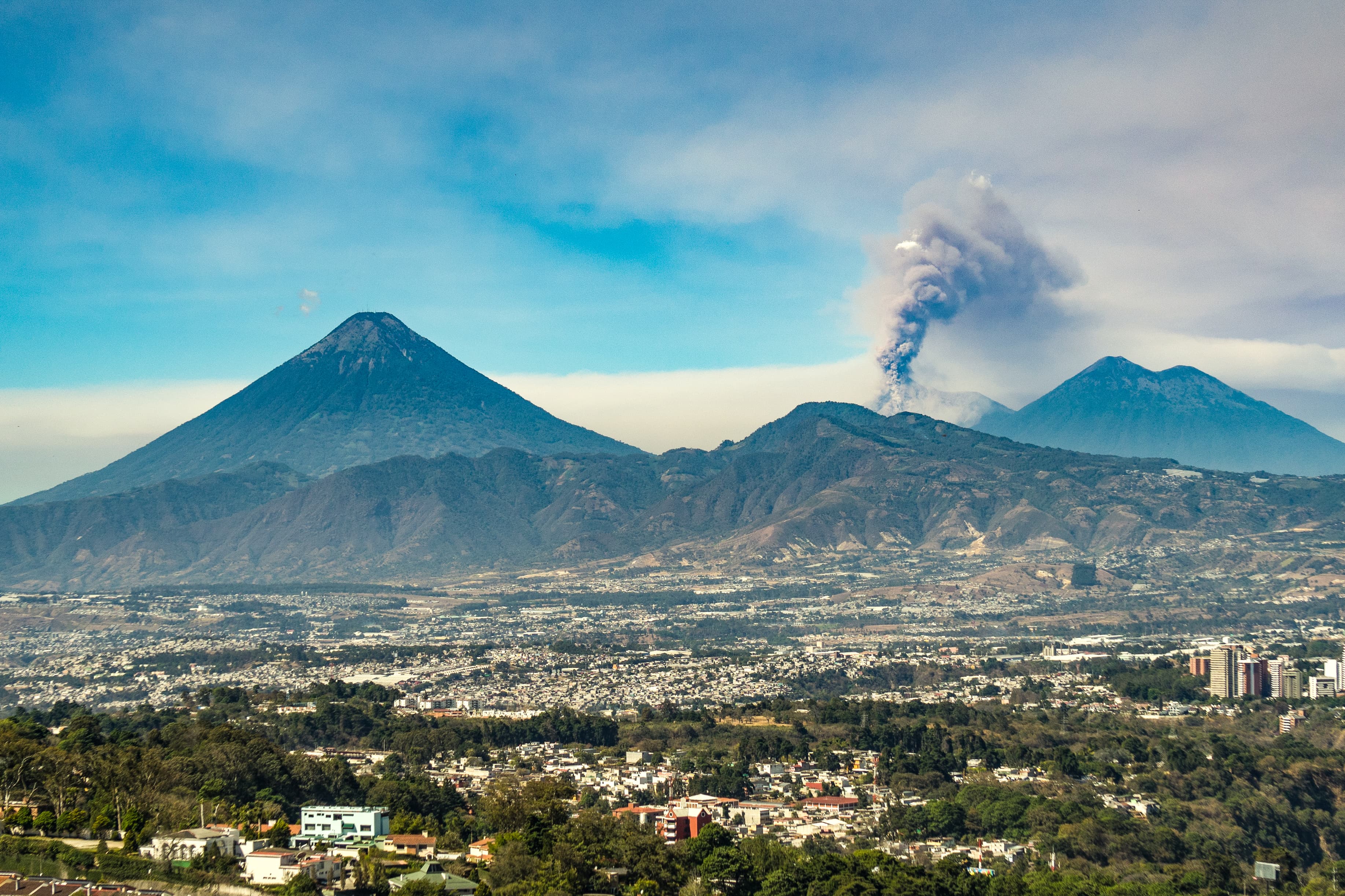 Fuego volcano erupting, seen from Guatemala City.